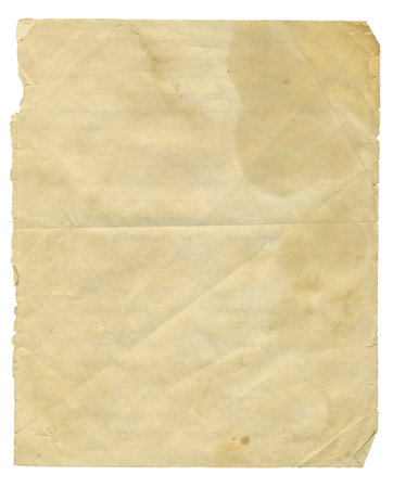 Texture of old yellowed paper with torn edges and curled corners isolated on white background. Vintage paper background with stains and foldsの写真素材