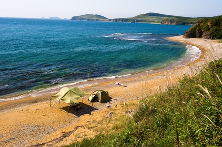 lone camping on desert beach on the russian isle Putyatin の写真素材