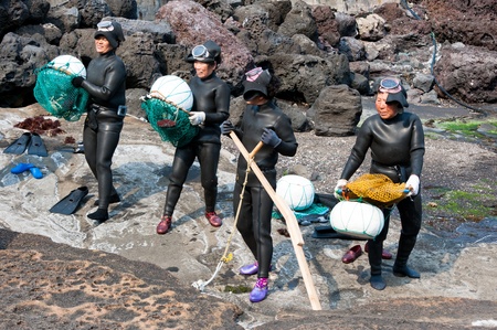 JEJU-DO - MARCH 27: Show of sea women -  Haenyo divers at Jeju-do of Korea, March 27, 2011,  Jeju, South Korea. のeditorial素材