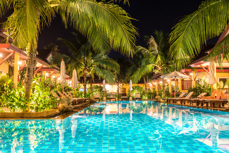 night view of beautiful swimming pool in tropical resort , Phuket, Thailand.のeditorial素材
