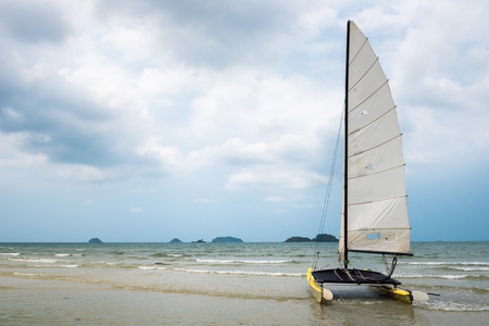 Catamaran sailboat on a tropical beach at Koh Chang island, Thailand