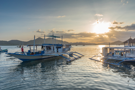 Traditional boat at terrace cafe at Coron Town at sunset view in Busuanga Island Palawan Philippines.の写真素材