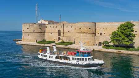 Castello Aragonese in Taranto, pictured as a cruise ship passes by. Castello Aragonese in Taranto, pictured as a cruise ship passes by.のeditorial素材