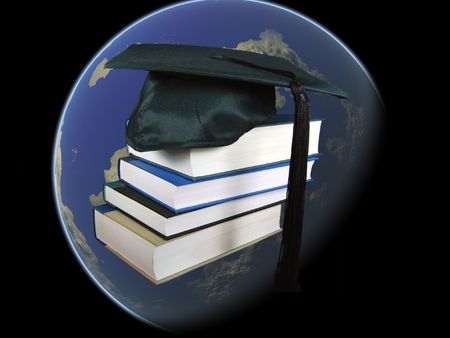 grad hat with books in worldの写真素材