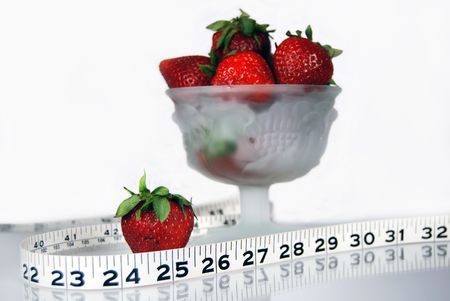 strawberry with tape measureの写真素材