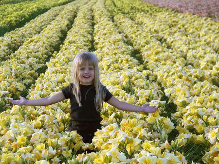 happy child in day lily fieldの写真素材