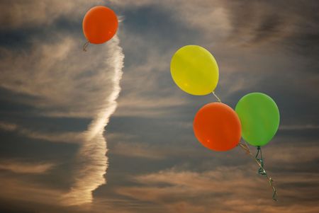 Balloons in a sunset sky.の写真素材