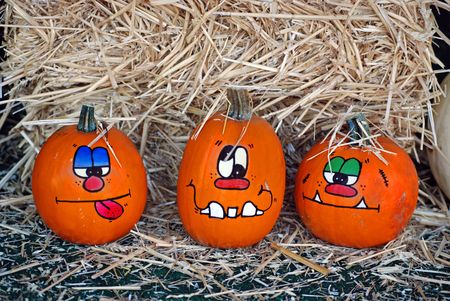 Fun faces painted on pumpkins.の写真素材