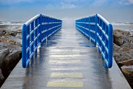 Wave spray misting the pier.の写真素材