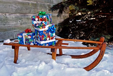 Christmas presents on a vintage sled.