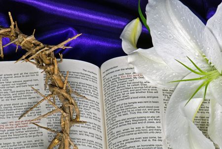 Lily and crown of thorns on Holy Bible.の写真素材