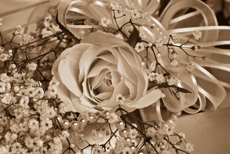 Pearl and rose bridal bouquet in sepia tonesの写真素材