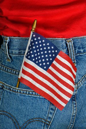 American flag in a blue jean pocket.の写真素材
