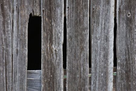 Hole in an old barn.の写真素材