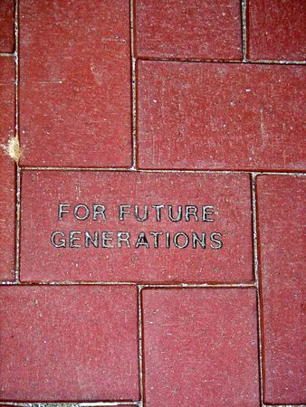 Message etched in a red brick walkway.の写真素材