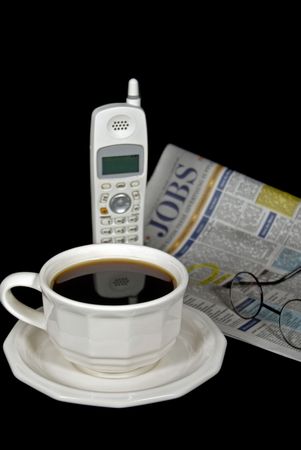 Cup of coffee and the employment section of newspaper.の写真素材