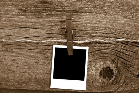 Old photo frame clipped to baling twine.