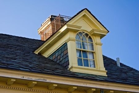 Upper window of an old restored mansion.の写真素材