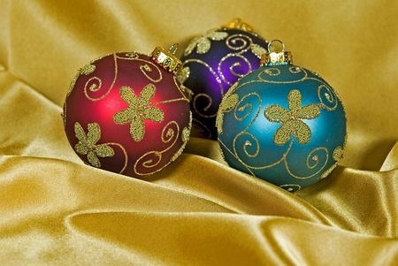 Holiday ornaments on gold satin.の写真素材
