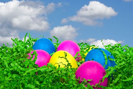 Colorful Easter eggs in fake grass.の写真素材