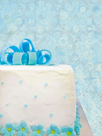 Birthday gift cake on textured background.の写真素材