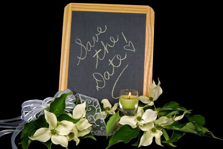 Wedding memo on black chalkboard with bridal bouquet.の写真素材