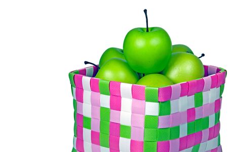 Green apples in bright basket.の写真素材