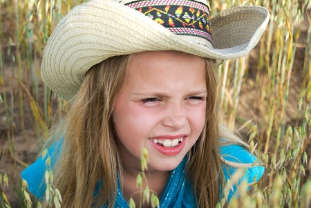 Young girl in grain field.の写真素材
