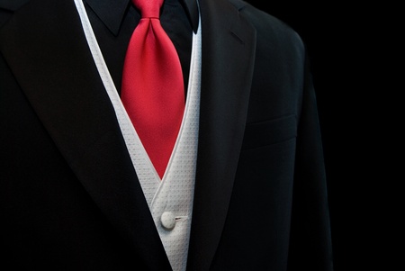 Red tie accenting a black tuxedo.の写真素材