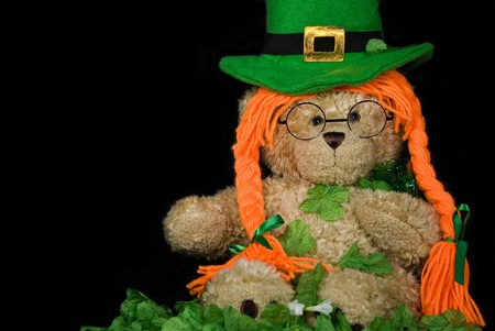 Irish teddy bear in shamrocks.の写真素材