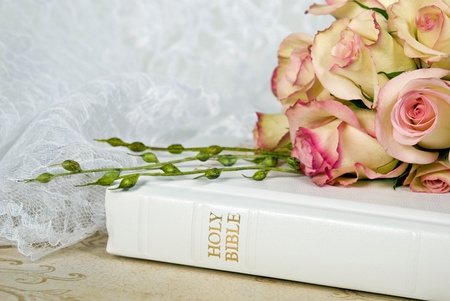 Bridal rose bouquet on white bible.の写真素材