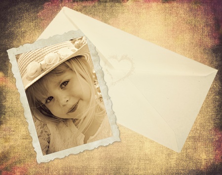 Little girl in old-fashioned snapshot with envelope.の写真素材