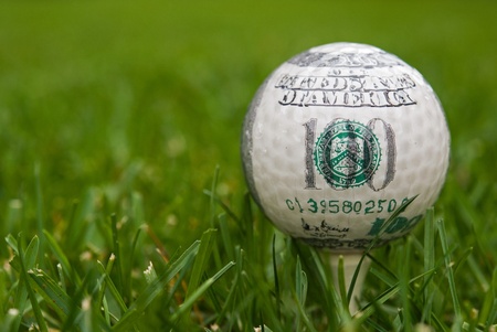 hundred dollar on golf ballの写真素材