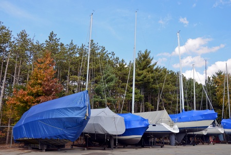 Winterized boats with protective covers.