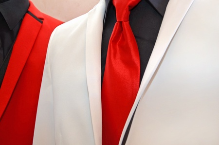 red tie accenting a white tuxedoの写真素材