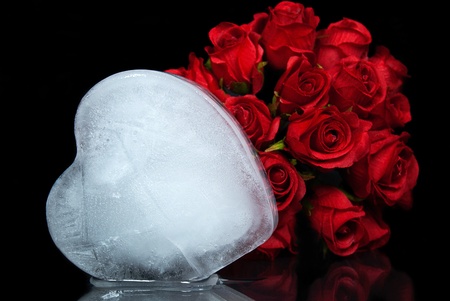 melting ice heart with red rose bouquetの写真素材