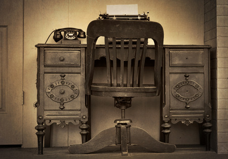 vintage desk with telephone and typewriter