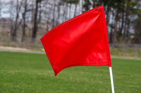 red flag in soccer fieldの写真素材