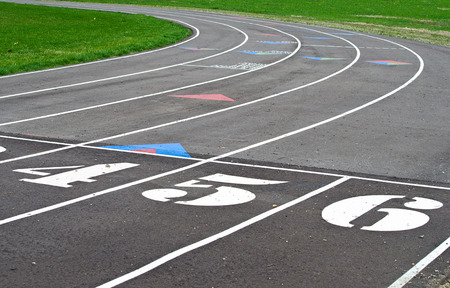 sports track with large number at starting line