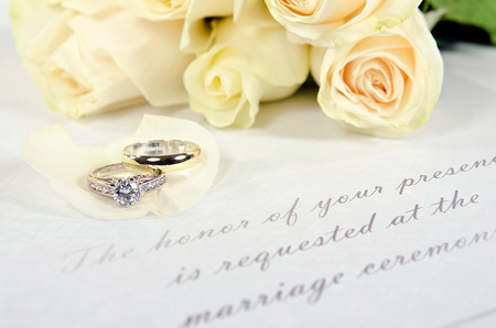 wedding rings on rose petalの写真素材