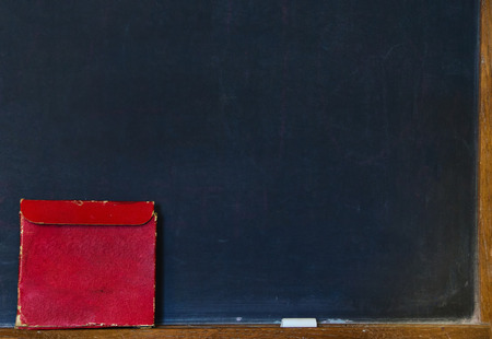 black chalkboard with box and chalkの写真素材