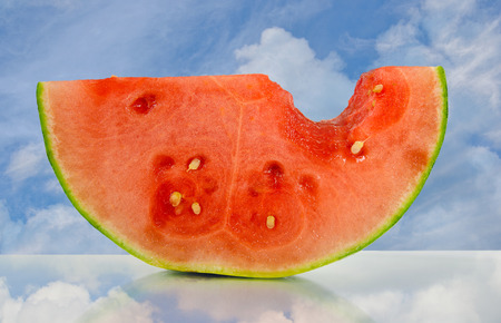 watermelon slice with sky reflectionの写真素材