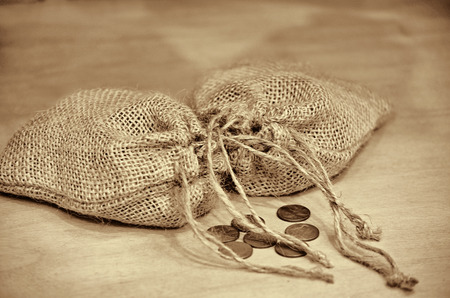 old pennies with burlap bagsの写真素材