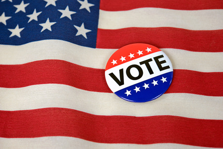 patriotic voting pin on American flag