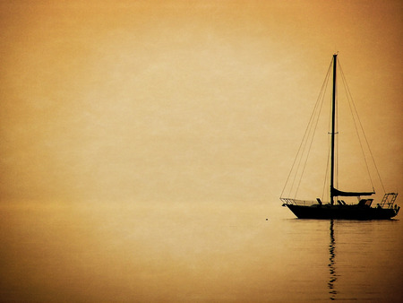 sailboat silhouette with texture and vignette