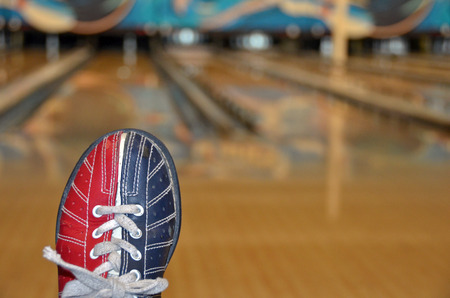 bowling shoe with bowling alley backgroundの写真素材