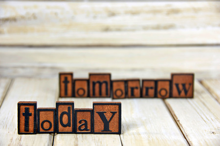 words today and tomorrow in vintage wooden letterpress typeの写真素材