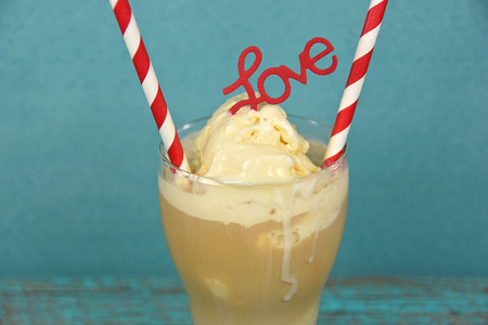 red and white striped straws in root beer float with love sign