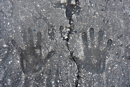 hand print indentation in concrete with crack