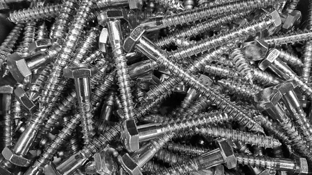 close up of new screws in a pile